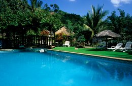 Comoros-Archipelago;-France;-Garden;-Indian-Ocean;-Kaleidos;-Kaleidos-images;-La-parole-à-limage;-Laurent-Abad;-Mayotte;-Stories-Pictures;-Sun-loungers;-Swimming-pool;-Thatched-shelter;-Tourism;-Vegetation